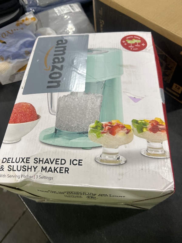 Photo 1 of Dash Deluxe Shaved Ice & Slushy Maker with Serving Pitcher, 1L, Multi-Purpose Ice Shaver Machine for Homemade Shaved Ice, Snow Cones, Slushies, Cocktails & More - Aqua