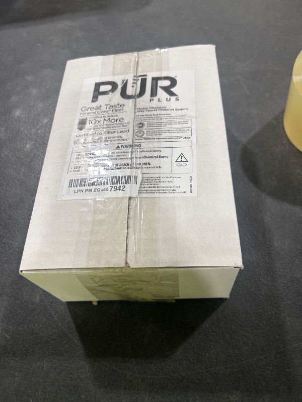 Photo 1 of PUR PLUS Vertical Faucet Mount Water Filtration System, Lead-Reducing Filter, Great-Tasting Water, Easy Install, Lasts 100 Gallons, Compatible with Sinks with External Aerators, Grey