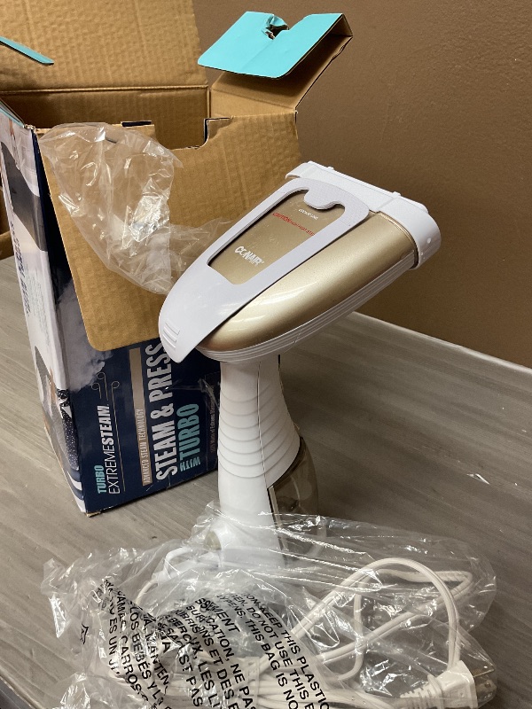 Photo 1 of Conair Handheld Garment Steamer for Clothes, Turbo ExtremeSteam 1875W Fabric Steamer, Portable Handheld Design, Strong Penetrating Steam, Amazon Exclusive, White/Champagne