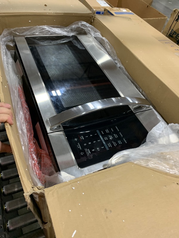 Photo 1 of BLACK+DECKER EM044KB19 Over The Range Microwave Oven with One Touch, 1000 Watts, 400 CFM and Auto Cooking, OTR 1.9 Cu.ft