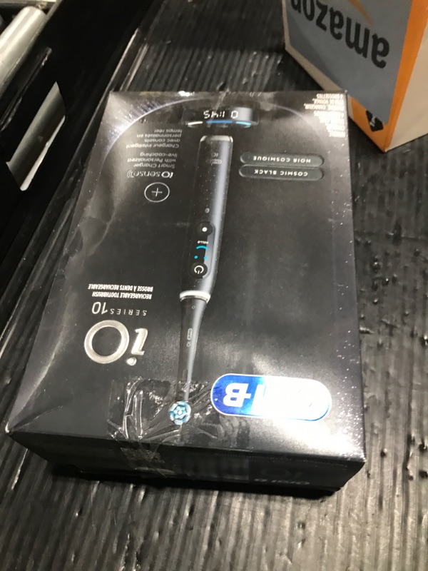Photo 1 of Oral-B iO Series 10 Rechargeable Electric Toothbrush with Visible Pressure Sensor to Protect Gums, 2 Min Timer, 7 Cleaning Settings, 4 Replacement Toothbrush Heads, and Charging Travel Case, Black