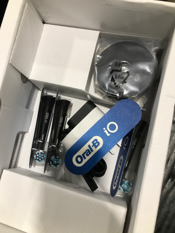 Photo 1 of Oral-B iO Series 10 Rechargeable Electric Toothbrush with Visible Pressure Sensor to Protect Gums, 2 Min Timer, 7 Cleaning Settings, 4 Replacement Toothbrush Heads, and Charging Travel Case, Black