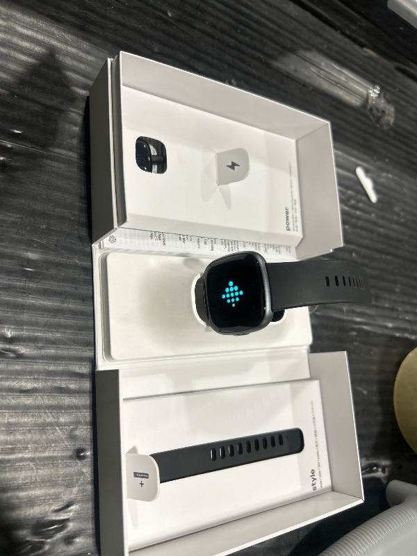 Photo 1 of Fitbit Versa 4 Fitness Smartwatch with Daily Readiness, GPS, 24/7 Heart Rate, 40+ Exercise Modes, Sleep Tracking and more, Black/Graphite, One Size (S & L Bands Included)