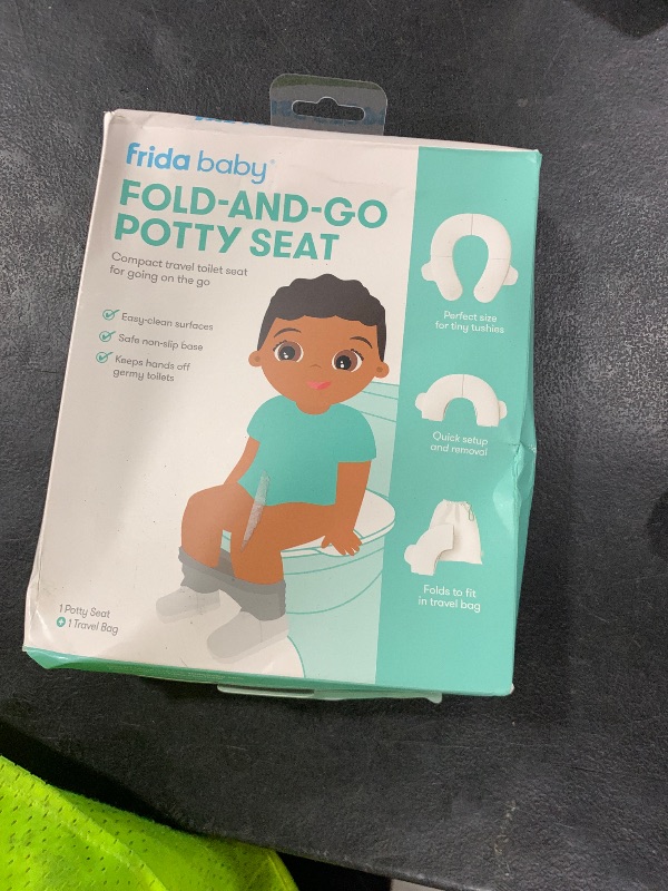 Photo 1 of Frida Baby Fold-and-Go Portable Potty Seat for Toilet, Foldable Travel Potty Seat for Toddler, Fits Round & Oval Toilets, Non-Slip Base, Handles, Includes Free Travel Bag