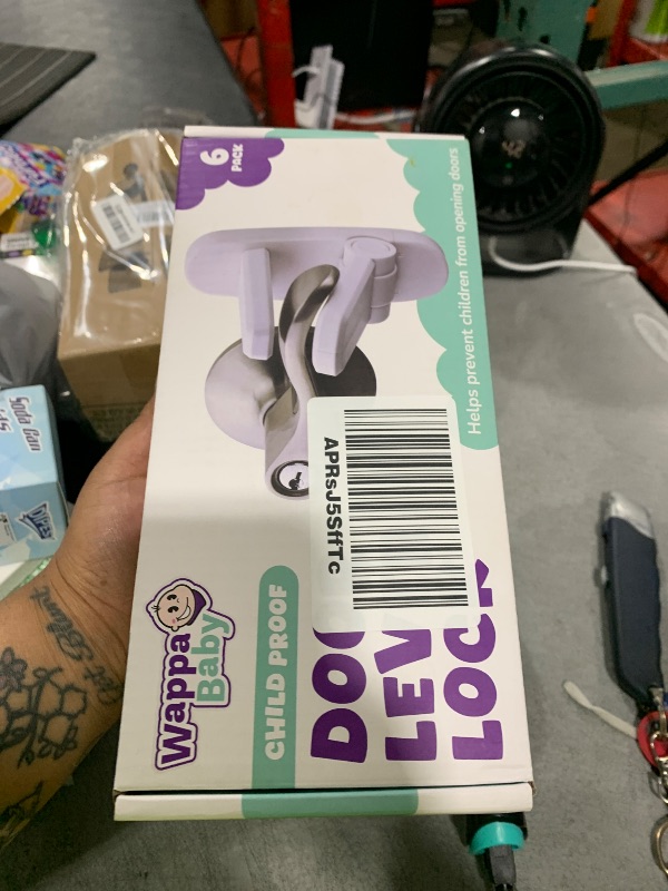 Photo 1 of Door Lever Lock (6 Pack) Prevents Toddlers from Opening Doors. 3.25" L * 1.5" W * 4.5" H Easy One Hand Operation for Adults. Durable ABS with 3M Adhesive Backing. Simple Install, No Tools Needed.