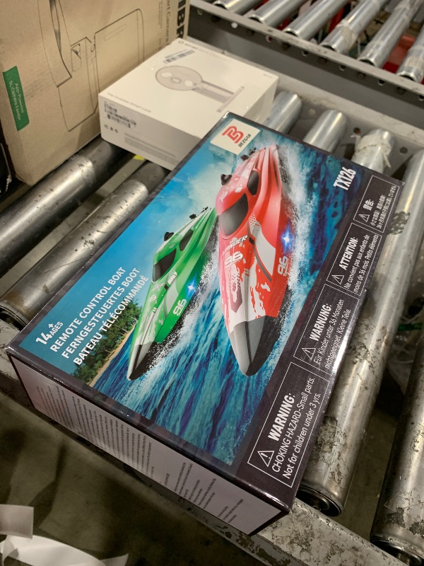Photo 1 of BEZGAR RC Boat, 12 inch Remote Control Boat for Kids and Adults, 25 KPH Fast RC Speed Boats with 700mAh Battery, Ideal Waterproof Toy Boats for Lakes & Pools - TX126 White