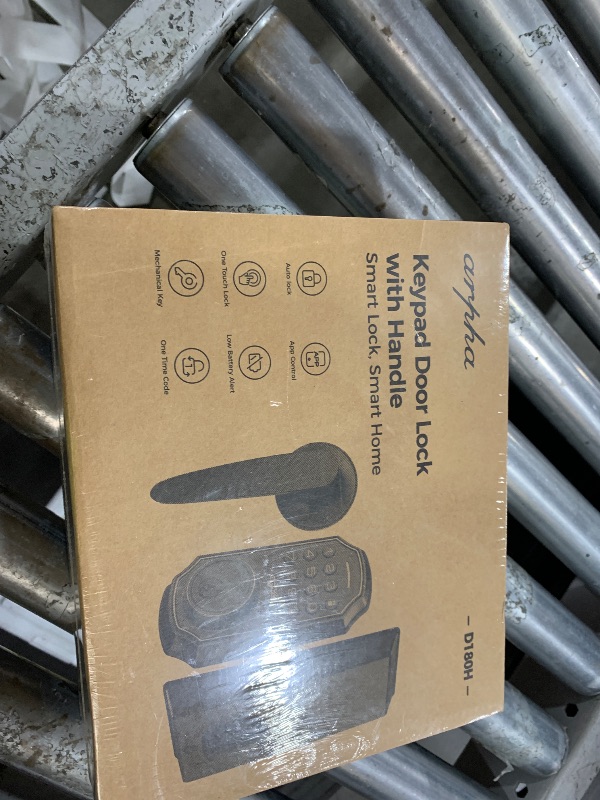 Photo 1 of keypad door lock with handle.