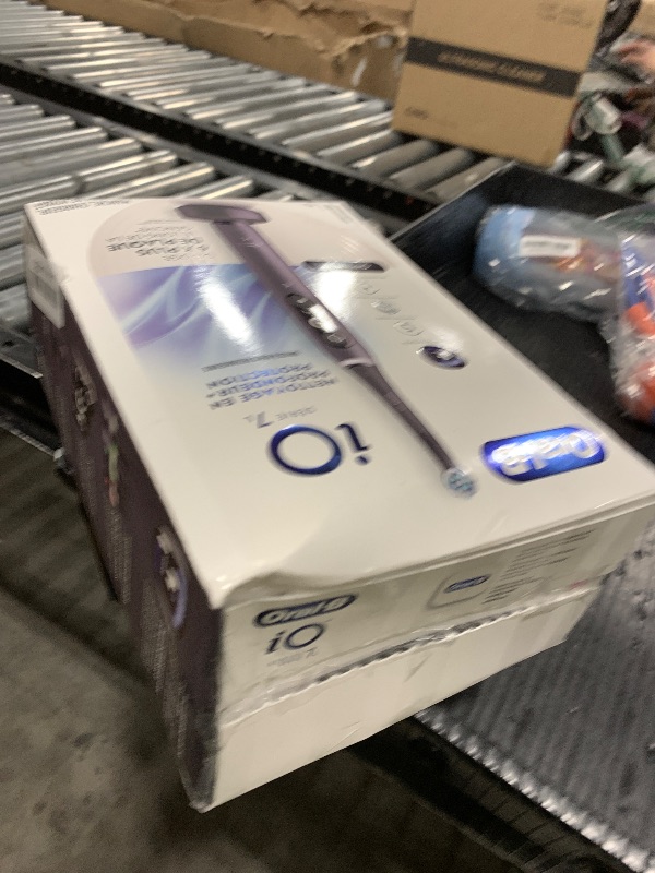 Photo 1 of Oral-B iO Deep Clean + Protect Rechargeable Electric Toothbrush, Black with a iO Series 7 Toothbrush, 2 Replacement Brush Heads, and a Charging Travel Case