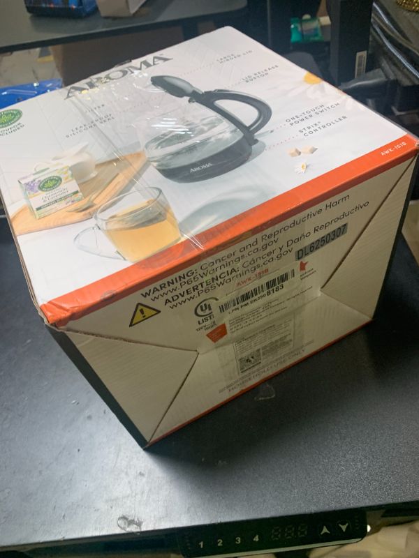Photo 1 of AROMA® 1.2L / 5-Cup Glass Electric Kettle with Cordless Pouring, Trigger-Release Lid, Automatic Shut-off, Black (AWK-151B)
