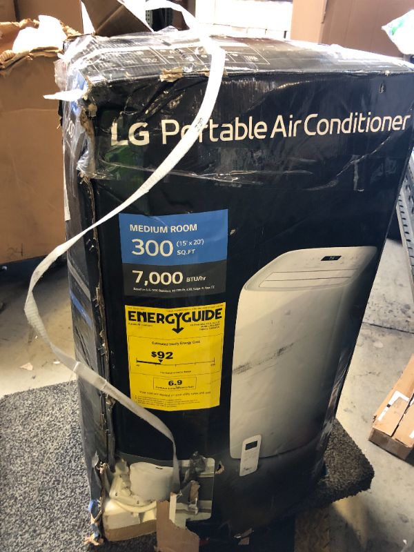 Photo 1 of LG 7,000 BTU Portable Air Conditioner, 115V, Cools 300 Sq.Ft. (12' x 25' Room Size), Portable Air Conditioner for Home with Quiet Operation, LCD Remote Control, and Window Installation Kit, White