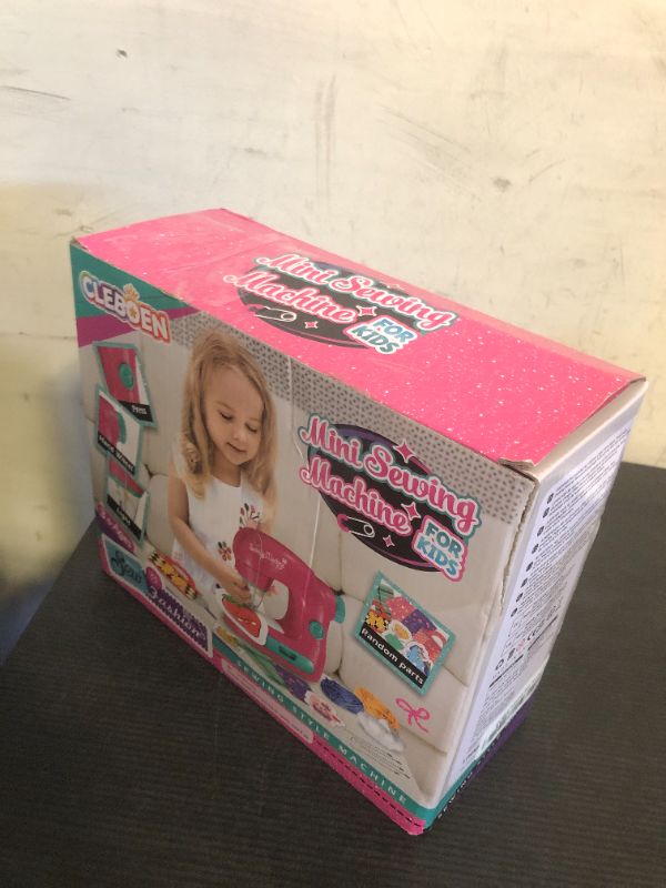 Photo 1 of Cleboen Mini Sewing Machine Toy Kit for Kids Beginners, 22pcs Portable Electric Sewing Machine With Sewing Kit, Light and Finger Guard, Birthday Christmas gift for Kids Girls 4-12