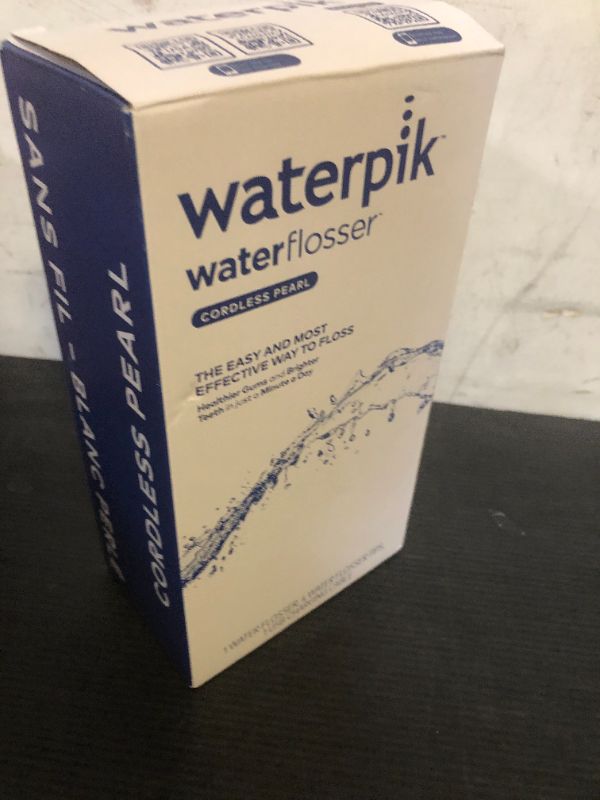 Photo 1 of Waterpik Cordless Pearl Rechargeable Portable Water Flosser for Teeth, Gums, Braces Care and Travel with 4 Flossing Tips - ADA Accepted, WF-13 White, Packaging May Vary