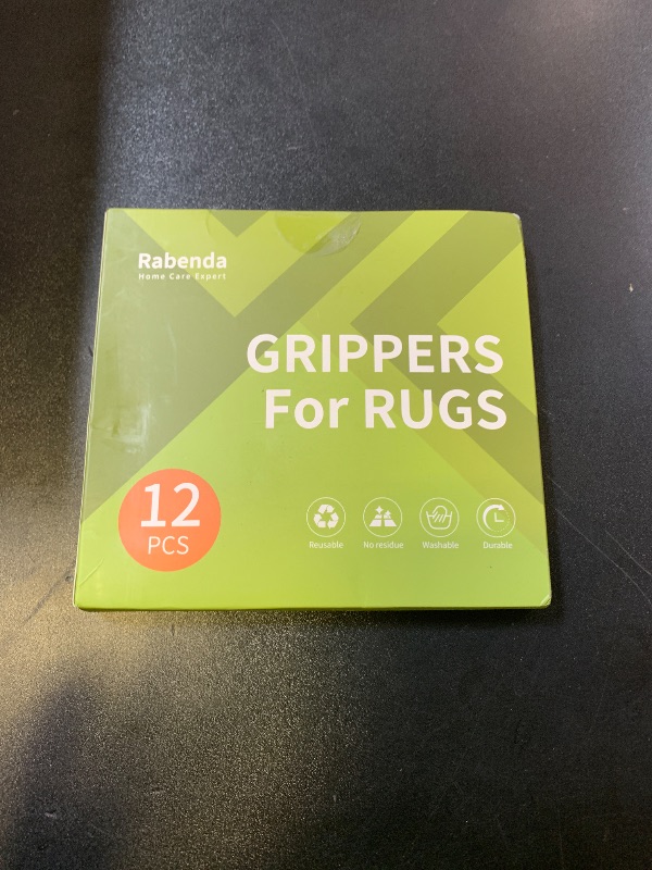 Photo 1 of Rabenda 12 Pcs Rug Tape, Non Slip Rug Pads Grippers for Hardwood Floors and Tiles, Reusable Carpet Tape for Area Rugs, Double-Sided Adhesive Rug Stickers Keep Corners Flat (Black)