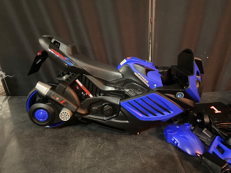 Photo 1 of Garvee Kids 6V Ride On Motorcycle, Battery Powered Ride On Toys w/Treaded Tires, Working Headlight, Horn, Music, Training Wheels, Stable Electric Toddler Motorcycle for Kids, Gift for Boys Girls, Blue