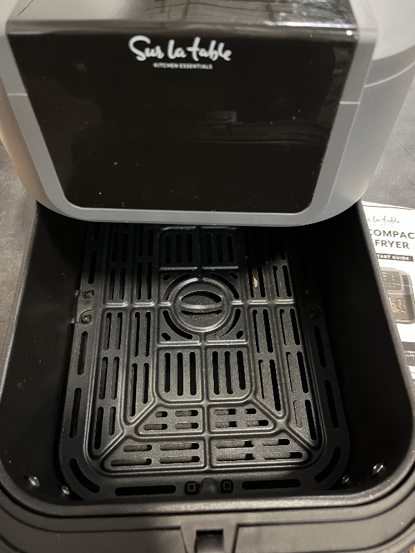 Photo 1 of Like New SUR LA TABLE KITCHEN ESSENTIALS 4-in-1 Compact 5-Quart Basket Air Fryer with Window for Easy Viewing, Digital Touchscreen Display with 8-Presets, Air Fry, Bake, Roast, Broil in Minutes, 1500w
