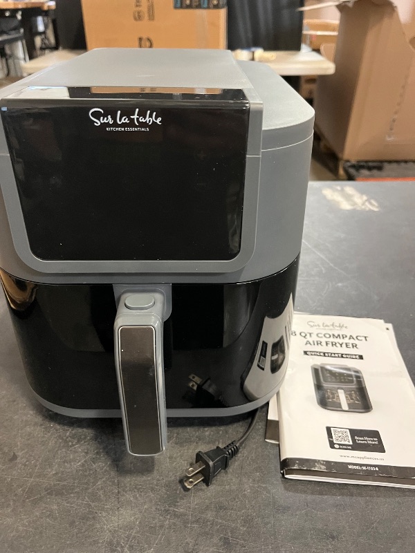 Photo 1 of Like New SUR LA TABLE KITCHEN ESSENTIALS 4-in-1 Compact 5-Quart Basket Air Fryer with Window for Easy Viewing, Digital Touchscreen Display with 8-Presets, Air Fry, Bake, Roast, Broil in Minutes, 1500w
