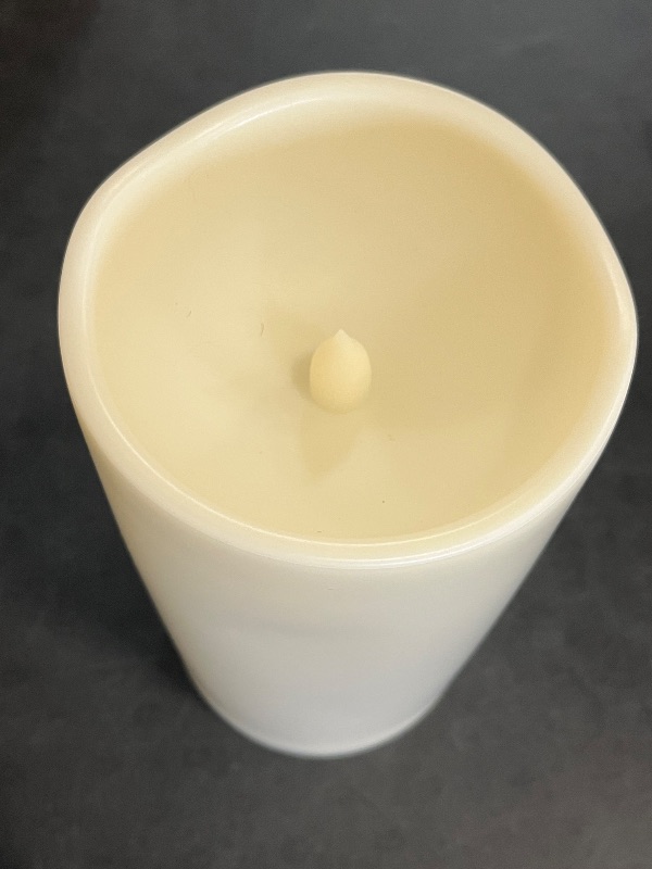 Photo 1 of iZAN Outdoor LED Flameless Candle with Timing Function Waterproof Plastic Realistic Flickering Battery Operated LED Pillar Candle Long Lasting Battery Life 3x6 inch Waved Edge
