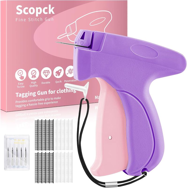 Photo 1 of Handheld Micro Tagging Stitch Gun for Clothes - Quick Clothing Fixer - Mini Sewing Kit - Includes 6 Needle, 1000 Black Fasteners & 1000 White Fasteners (Purple)
