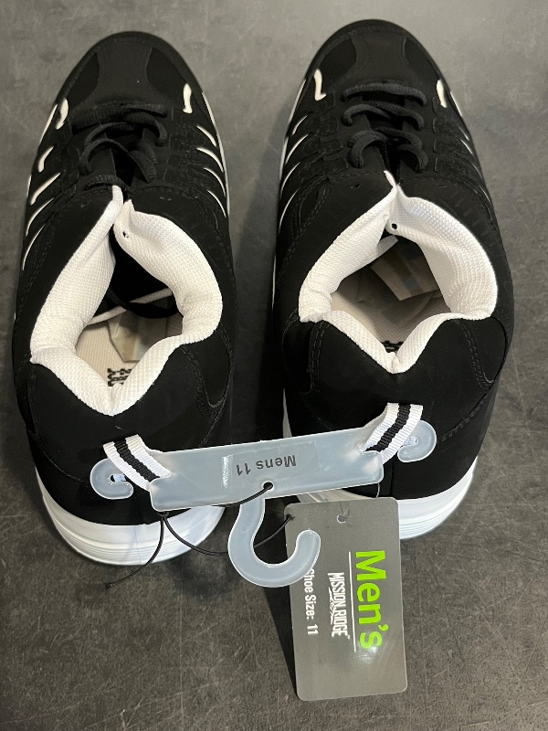 Photo 1 of Size 11 Mens Black and White Sneakers