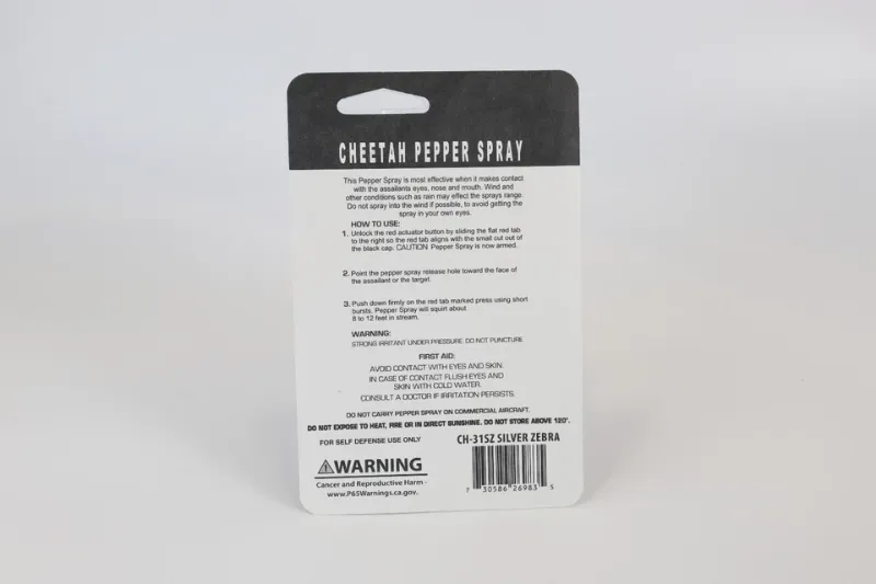 Photo 1 of 2 pack Cheetah pepper spray flat pink in color with key chain ring