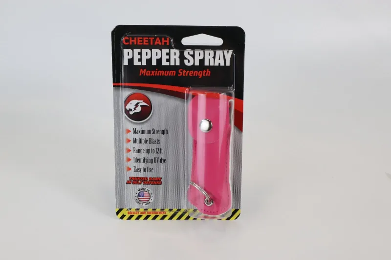 Photo 1 of 2 pack Cheetah pepper spray flat pink in color with key chain ring