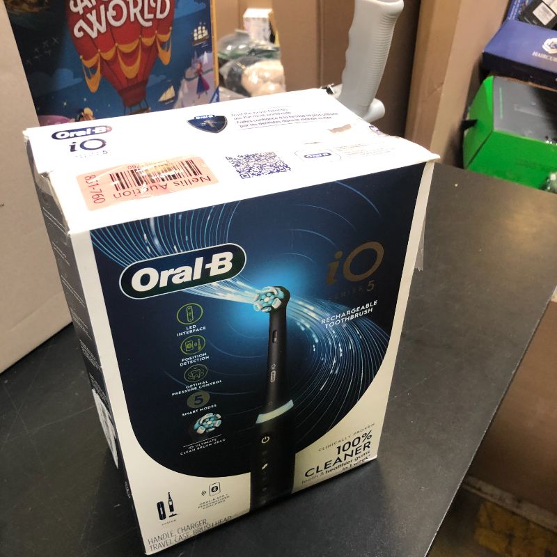 Photo 1 of Oral-B iO Series 5 Rechargeable Electric Toothbrush with Visible Pressure Sensor to Protect Gums, 2 Minute Timer, 5 Cleaning Settings, 1 Replacement Toothbrush Heads, and Travel Case, Black