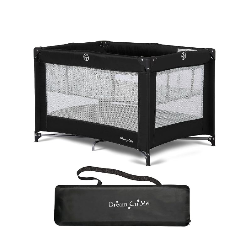 Photo 1 of Dream On Me Zazzy Portable Playard with Bassinet in Black, Lightweight Packable and Easy Setup Baby Playard with Mattress and Travel Bag
