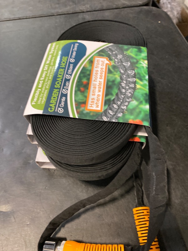 Photo 1 of LAVEVE Flat Garden Soaker Hose 200 FT, Flexible Water Hose Irrigation Tubing, Leakproof Drip Hose Watering for Garden, Lawn, Flower Bed, Vegetable Field (50 FT x 4Pack)