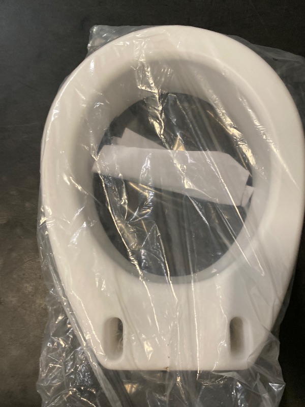 Photo 1 of Carex Toilet Seat Riser, Round Raised Toilet Seat Adds 3.5 inches to Toilet Height, for Assistance Bending or Sitting, 300 Pound Weight Capacity Toilet Riser