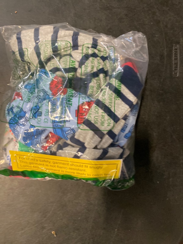 Photo 1 of  24 Months Simple Joys by Carter's Baby Boys' 3-Pack Snug Fit Footless Cotton Pajamas, Blue Firetruck/Grey Stripe/White Dinosaur,