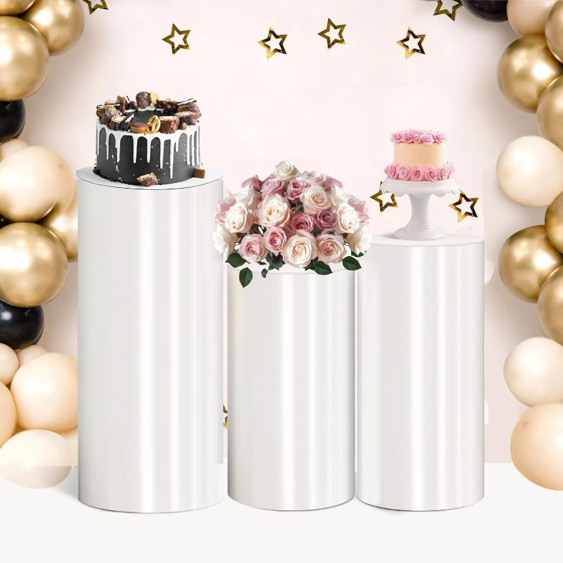 Photo 1 of Cylinder Pedestal Stand PVC White Display Plinth Pedestal Stand Portable Sturdy Cylinder Stands cilindros para Fiestas redondos for Party Wedding Birthday Decor Cupcakes Floral Arrangement-3 PCS