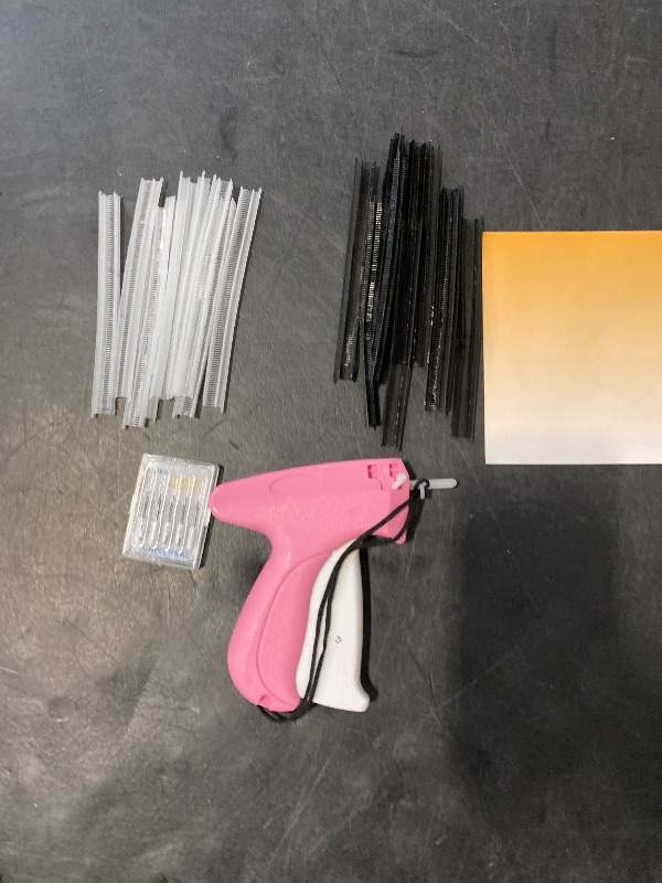 Photo 1 of Stitch  For Clothes - Handheld Stitch Tag Gun Quick Clothing Fixer - Tagging Gun - Sewing Kit Includes 6 Needle, 1000 Black Fasteners & 1000 White Fasteners (Pink)