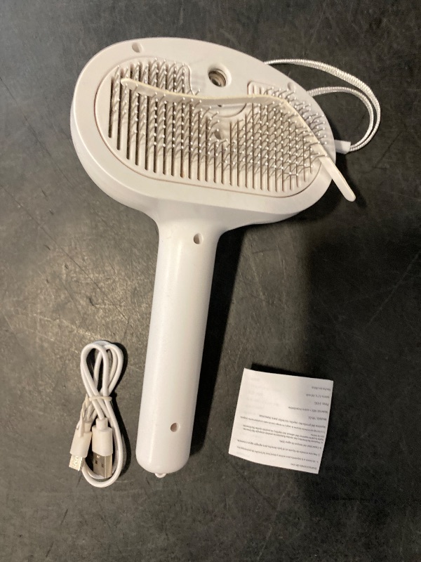 Photo 1 of Cat Dog Grooming Brush 5-in-1 Pet Grooming Spray Brush Comb for Massaging and Cleaning Shedding Pet Hair, 1-Touch Release Button for Long/Short Hair Pets (White)