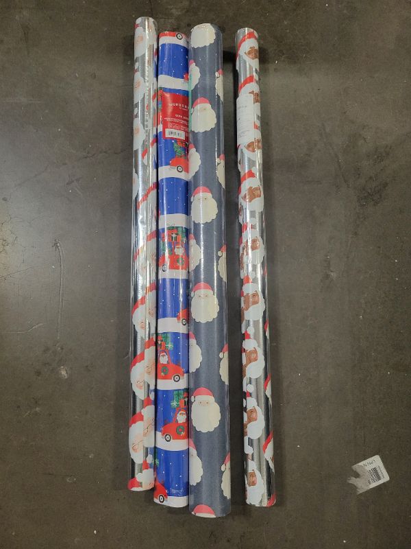 Photo 1 of 4 Rolls of Santa wrapping paper (125 sq.ft all together) 