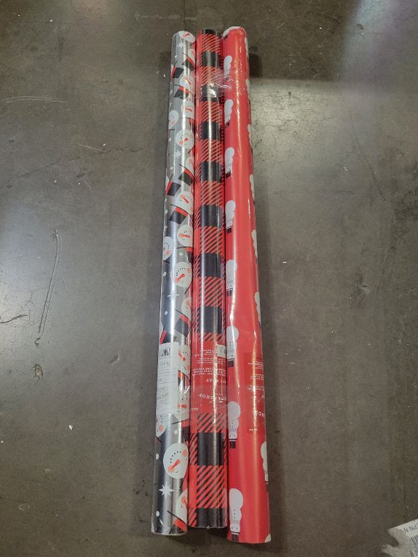 Photo 1 of 3 rolls of christmas wrapping paper ( 125 sq ft. all together) 