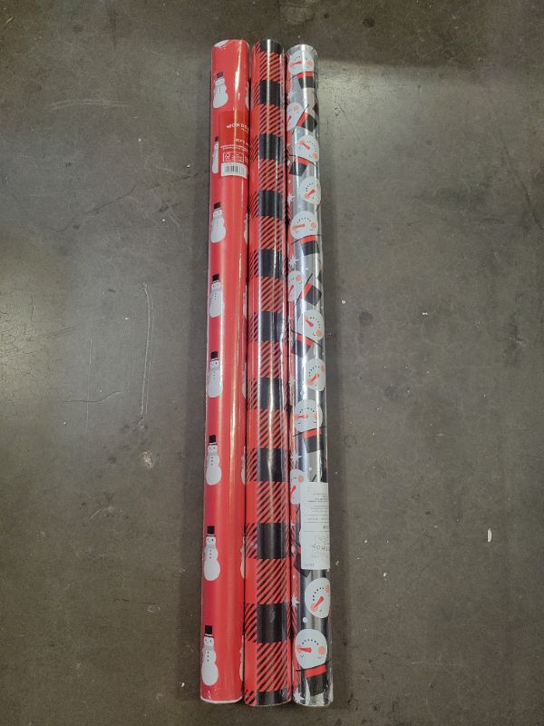 Photo 1 of 3 rolls of christmas wrapping paper ( 125 sq ft. all together) 