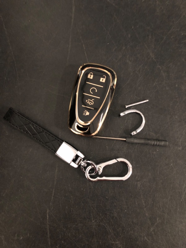 Photo 1 of QBUC for Chevy Key Fob Cover With Keychain Gold Trim Soft TPU Protection Case Compatible with 2016-2025 Chevy Equinox Malibu Camaro Blazer Traverse Trailblazer Trax 5-Buttons(Gold Trim Black)
