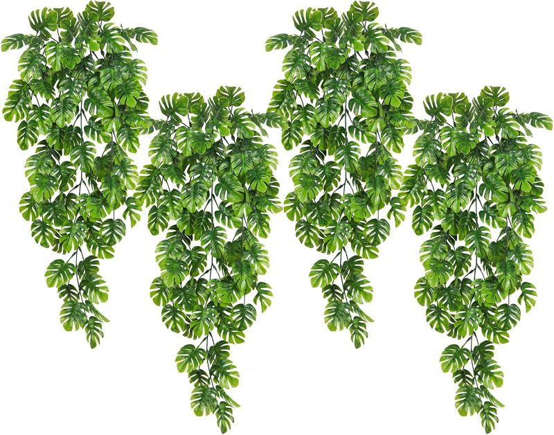 Photo 1 of Artificial Hanging Plants 4 Pack, Fake Hanging Monstera Leaves Ivy Vine Faux Greenery Tropical Palm Leaves Outdoor Hanging Plants UV Resistant Jungle Leaf Plant

