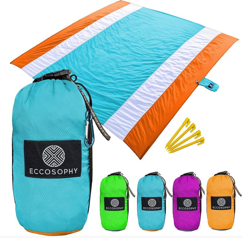 Photo 1 of ECCOSOPHY Sandproof Beach Blanket - Oversized Sand Free Beach Mat 9'x10' - Lightweight Outdoor Picnic Blanket Anchored with 4 Corner Sand Pockets & Plastic Stakes - Heat Proof, Quick Drying & Compact