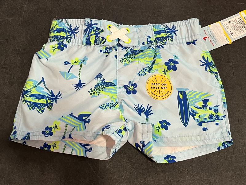 Photo 1 of 12M Baby Boys' Beach Scenic Printed Swim Board Shorts - Cat & Jack™ Light Blue 12M: UPF 50+, Elastic Waist, Botanical Pattern