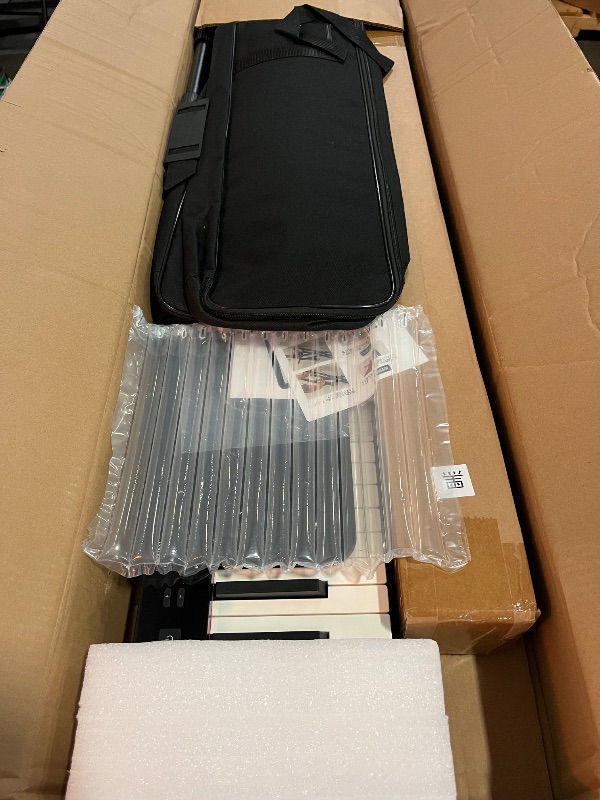 Photo 1 of NikoMaku Semi-weighted 88 Keys Piano Keyboard Compact Portable Digital Piano Set for Beginners with Stand, Carrying Case, Sustain Pedal, Headphones, SWAN-S Black
