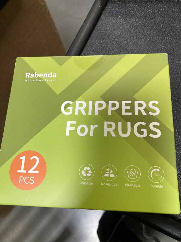 Photo 1 of Rabenda 12 Pcs Rug Tape, Non Slip Rug Pads Grippers for Hardwood Floors and Tiles, Reusable Carpet Tape for Area Rugs, Double-Sided Adhesive Rug Stickers Keep Corners Flat (Black)