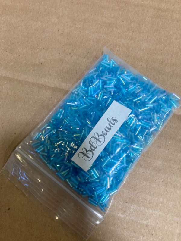 Photo 1 of 50 Grams of 1200 Ming Tree Economical 1/4 inch Long 6mm Glass Bugle Tube Seed Beads (Rainbow Aqua Blue)