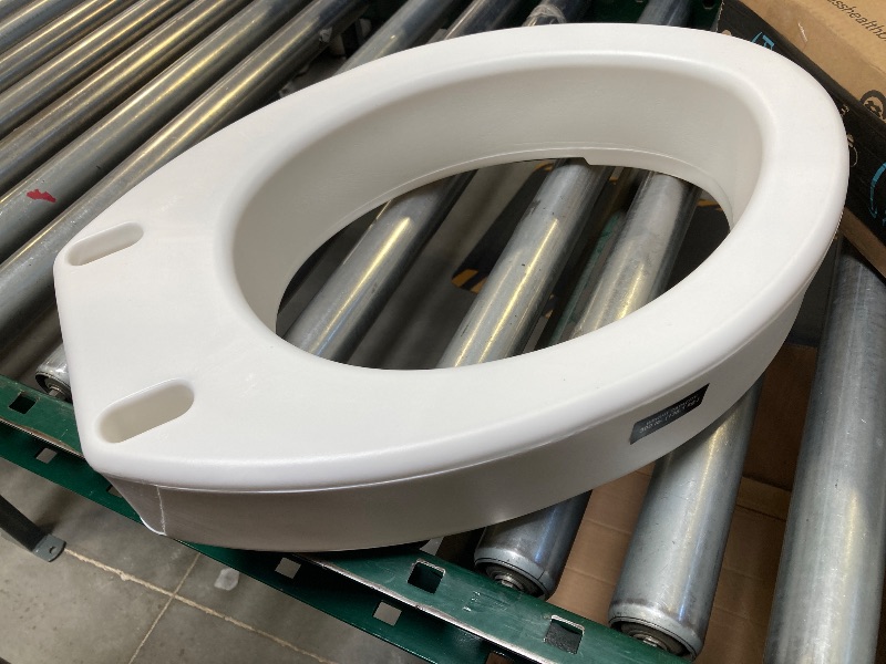 Photo 1 of Carex Toilet Seat Riser, Elongated Raised Toilet Seat Adds 3.5 inches to Toilet Height, for Assistance Bending or Sitting, 300 Pound Weight Capacity Toilet Riser
