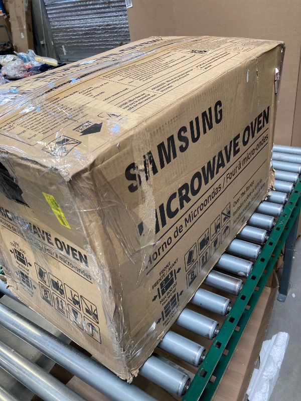 Photo 1 of Small dent on the back---SAMSUNG ME17R7021ES 1.7 cu. ft. Over-the-Range Microwave in Stainless Steel