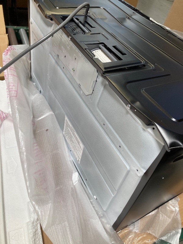 Photo 1 of Small dent on the back---SAMSUNG ME17R7021ES 1.7 cu. ft. Over-the-Range Microwave in Stainless Steel