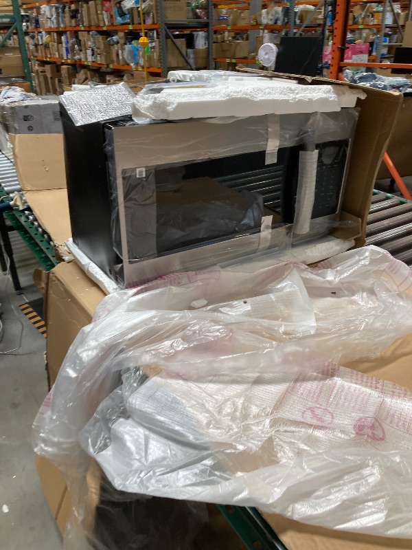 Photo 1 of Small dent on the back---SAMSUNG ME17R7021ES 1.7 cu. ft. Over-the-Range Microwave in Stainless Steel