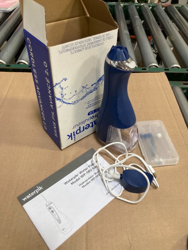 Photo 1 of Waterpik Cordless Advanced 2.0 Water Flosser For Teeth, Gums, Braces, Dental Care With Travel Bag and 4 Tips, ADA Accepted, Rechargeable, Portable, and Waterproof, Blue WP-583, Packaging May Vary