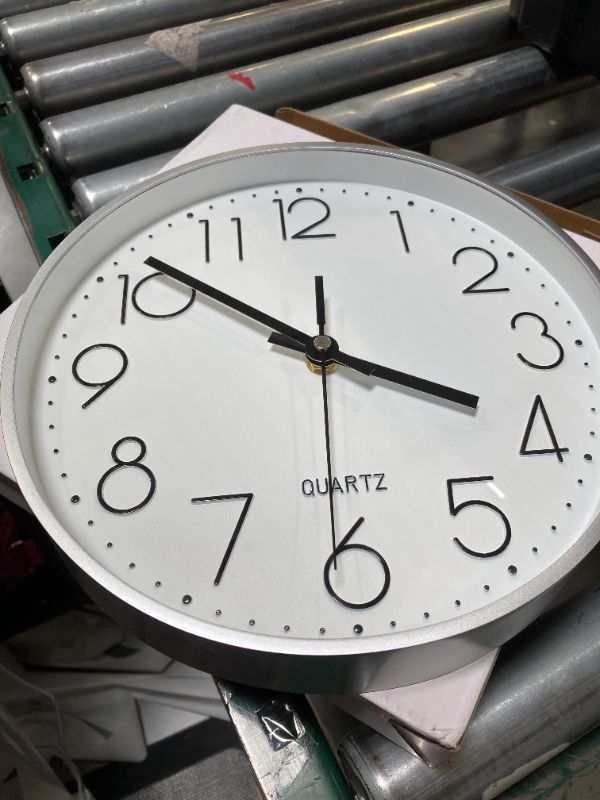 Photo 1 of jomparis 10 Inch Silver Wall Clock Battery Operated Silent & Non-Ticking Wall Clock for Home Office Bathroom