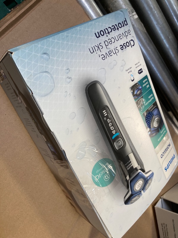 Photo 1 of Philips Norelco Shaver 7300, Rechargeable Wet & Dry Electric Shaver with SenseIQ Technology, Pop-up Trimmer, Charging Stand, Click-on Nose Trimmer, & Travel Case, S7887/92